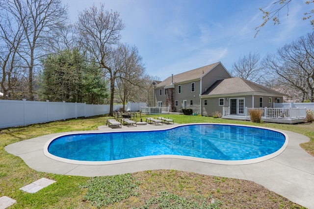view of swimming pool featuring a deck and french doors