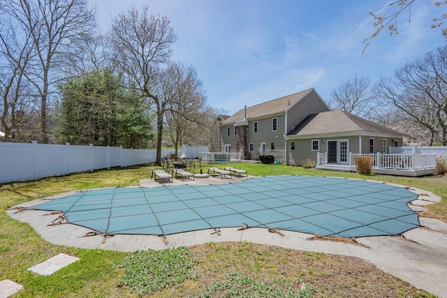 view of swimming pool with a deck and french doors