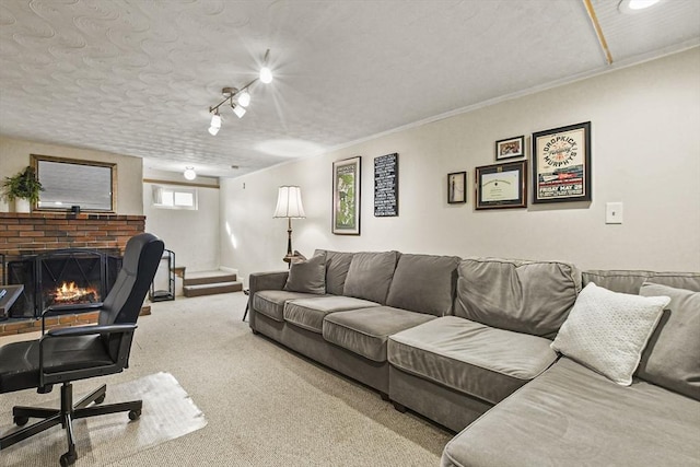 office featuring a brick fireplace, ornamental molding, a textured ceiling, and carpet flooring