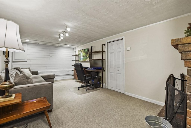 office with ornamental molding, carpet flooring, and a textured ceiling