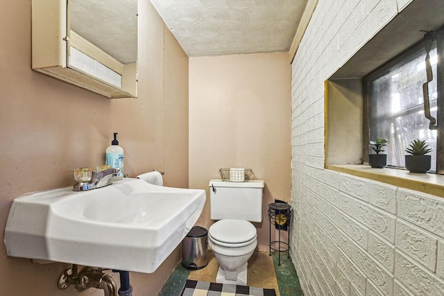 bathroom with toilet and sink