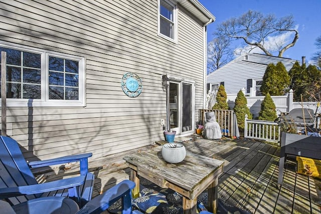 wooden terrace with a grill