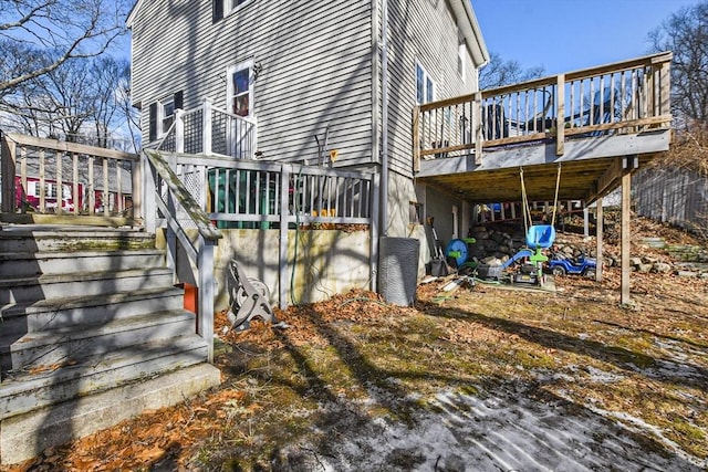 view of property exterior featuring a wooden deck