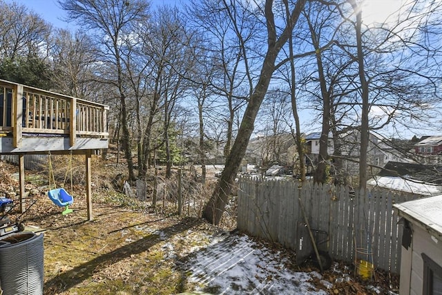 snowy yard with a playground