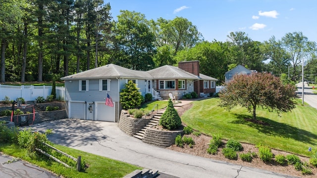 57 Hampton St, Auburn, MA 01501 - view of front of house with driveway, a garage, a chimney, and stairs