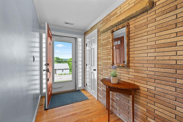 57 Hampton St, Auburn, MA 01501 - foyer with light wood-type flooring, crown molding, and brick wall