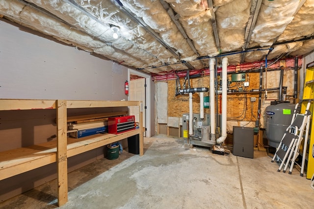 57 Hampton St, Auburn, MA 01501 - unfinished basement with a heating unit