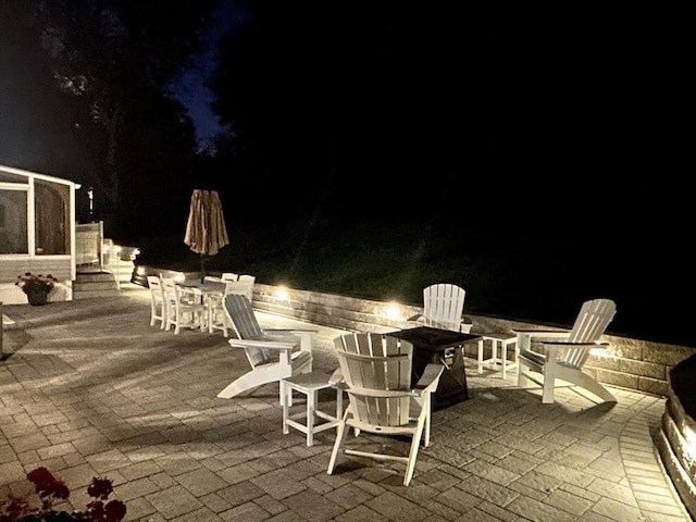 57 Hampton St, Auburn, MA 01501 - patio at night with an outdoor fire pit and a patio