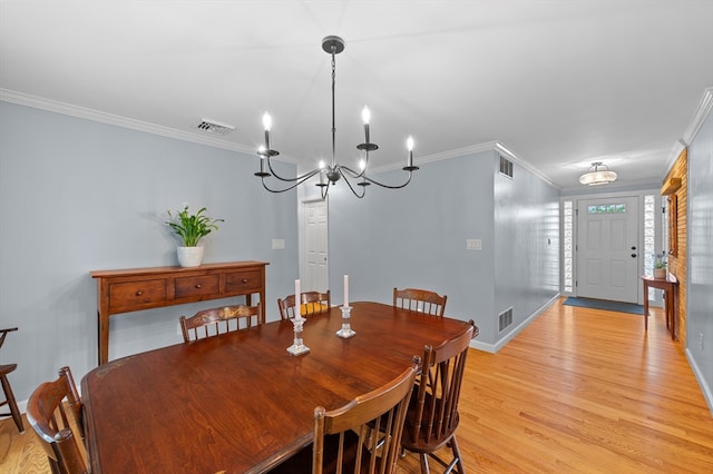 57 Hampton St, Auburn, MA 01501 - dining room with ornamental molding, light wood-style flooring, and a chandelier
