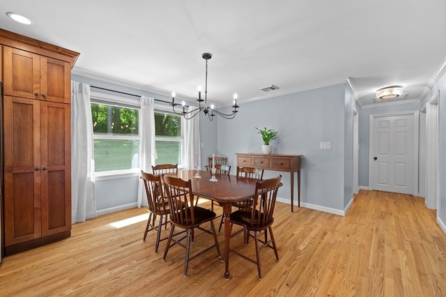 57 Hampton St, Auburn, MA 01501 - dining area with a chandelier, ornamental molding, and light wood-style flooring