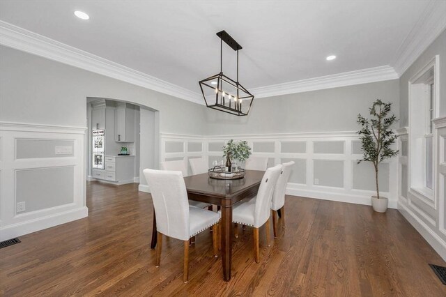 kitchen with a kitchen island, double oven, dark hardwood / wood-style flooring, and pendant lighting