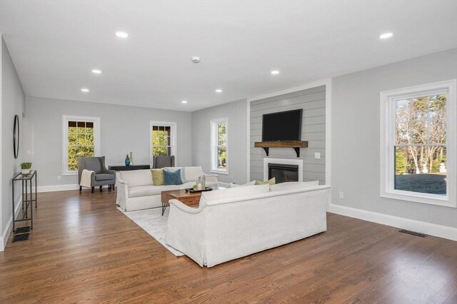 living room featuring light hardwood / wood-style flooring and vaulted ceiling