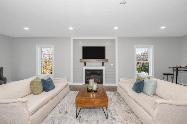 unfurnished dining area featuring ornamental molding, dark hardwood / wood-style flooring, sink, and beverage cooler