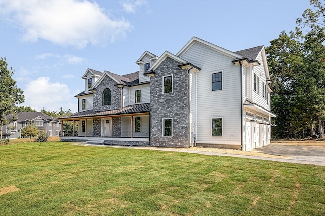 view of front of home featuring a front lawn and a garage