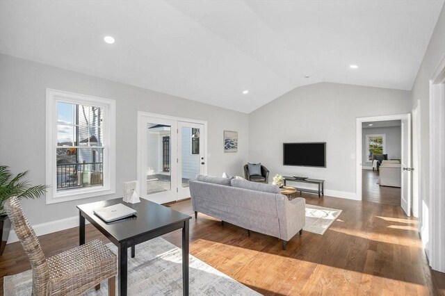 unfurnished living room featuring a large fireplace and wood-type flooring