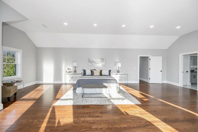 foyer featuring ornamental molding, a towering ceiling, hardwood / wood-style floors, and a healthy amount of sunlight