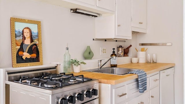 11 Revere Unit 4, Boston, MA 02114 - kitchen featuring stainless steel range with gas stovetop, dishwasher, light countertops, and white cabinets
