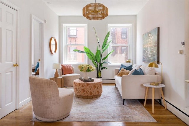 11 Revere Unit 4, Boston, MA 02114 - sitting room with a baseboard heating unit, wood finished floors, and a chandelier