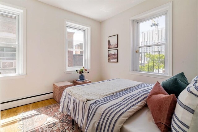 11 Revere Unit 4, Boston, MA 02114 - bedroom featuring baseboard heating and wood finished floors