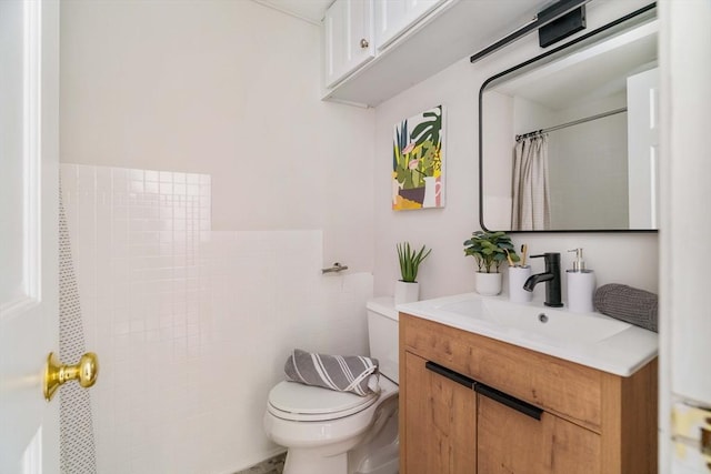 11 Revere Unit 4, Boston, MA 02114 - full bathroom featuring toilet, vanity, and a shower with shower curtain