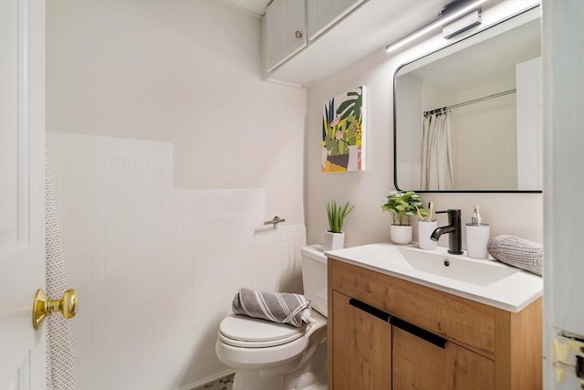 11 Revere Unit 4, Boston, MA 02114 - bathroom with toilet, vanity, curtained shower, and tile walls