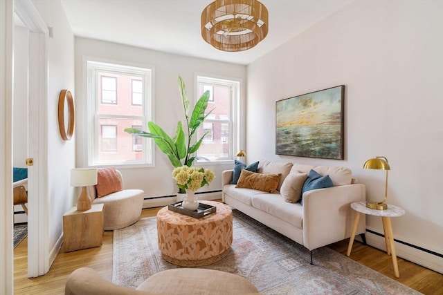 11 Revere Unit 4, Boston, MA 02114 - living room featuring a baseboard heating unit, light wood-type flooring, baseboards, and baseboard heating