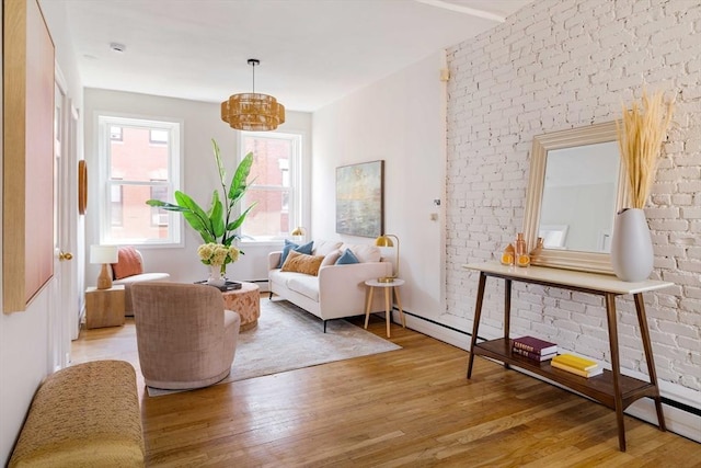 11 Revere Unit 4, Boston, MA 02114 - living area with wood finished floors, a chandelier, and brick wall