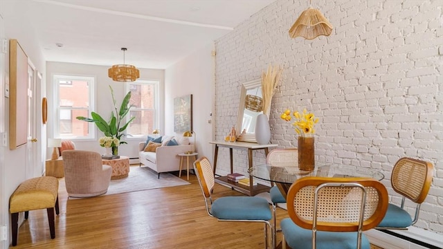 11 Revere Unit 4, Boston, MA 02114 - living area featuring light wood-style floors and brick wall