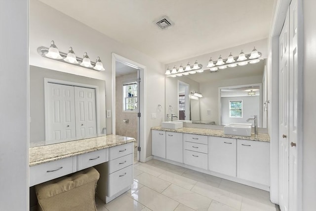 full bath with vanity and visible vents