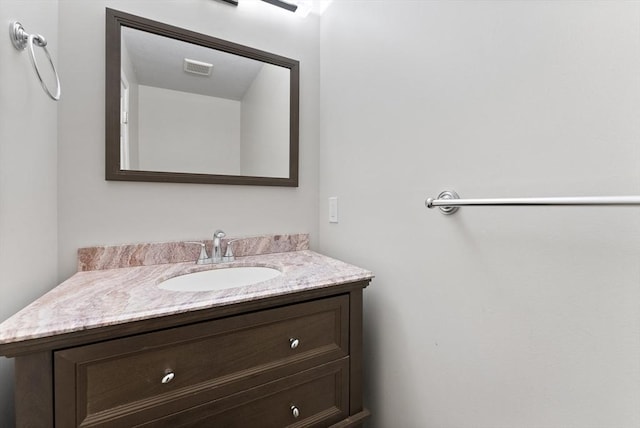 bathroom with visible vents and vanity