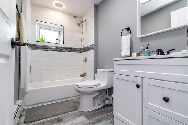 full bathroom with bathing tub / shower combination, toilet, a baseboard radiator, wood tiled floor, and vanity