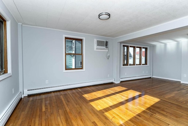 unfurnished room with baseboard heating, a baseboard radiator, wood-type flooring, and a wall mounted air conditioner