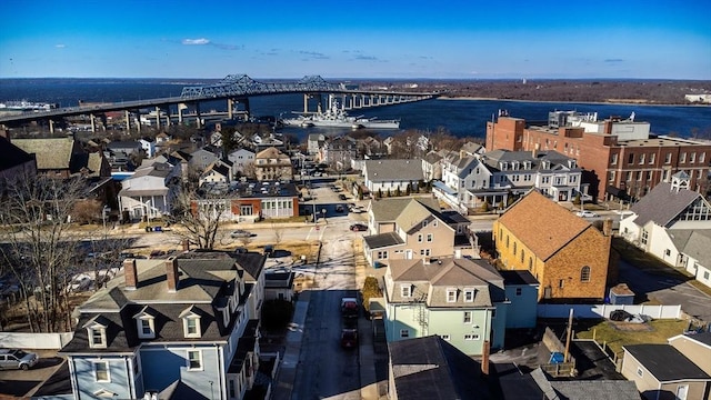 birds eye view of property with a water view and a residential view