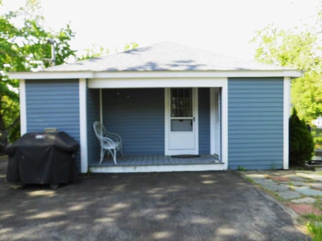 55A Millville Cir, Salem, NH 03079 - doorway to property featuring covered porch