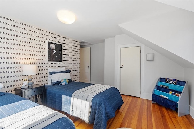 bedroom featuring wood finished floors