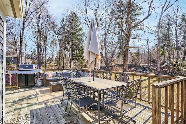 deck with outdoor dining space, an outdoor living space, and grilling area