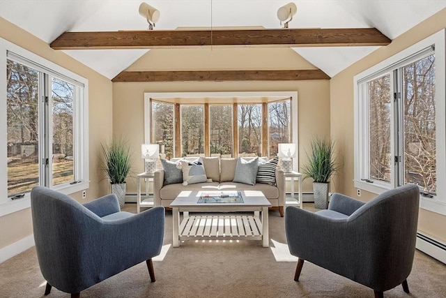 carpeted living area featuring a baseboard heating unit, a healthy amount of sunlight, and vaulted ceiling with beams