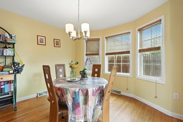 82 Lloyd Ave, Springfield, MA 01119 - dining space with hardwood / wood-style floors and a chandelier