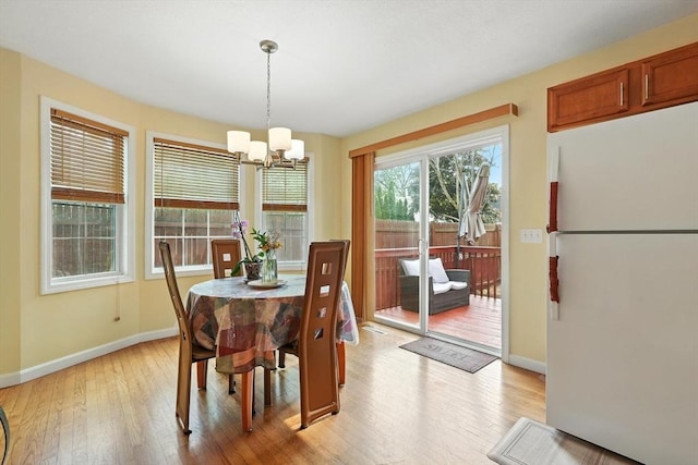 82 Lloyd Ave, Springfield, MA 01119 - dining space featuring light wood finished floors and a chandelier