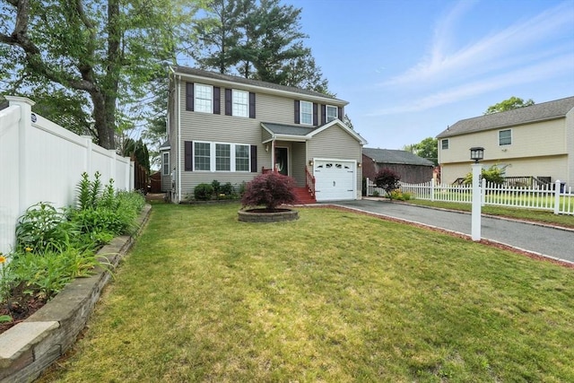 82 Lloyd Ave, Springfield, MA 01119 - traditional-style house featuring asphalt driveway and a garage