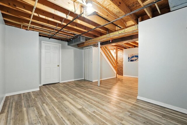 82 Lloyd Ave, Springfield, MA 01119 - finished below grade area featuring stairway and wood finished floors