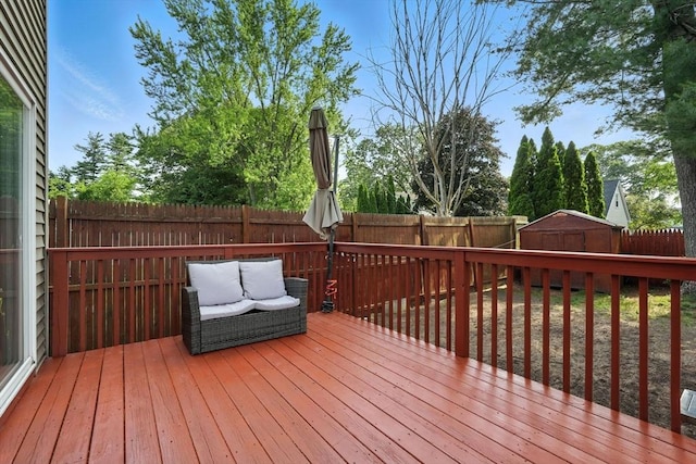 82 Lloyd Ave, Springfield, MA 01119 - wooden deck with a fenced backyard and a storage shed