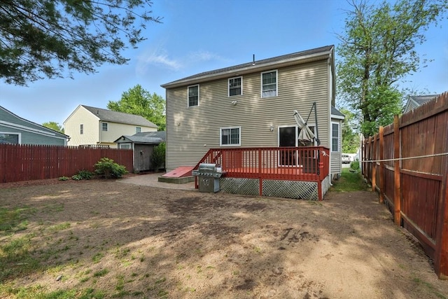 82 Lloyd Ave, Springfield, MA 01119 - rear view of house featuring a deck and a fenced backyard