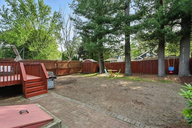 82 Lloyd Ave, Springfield, MA 01119 - fenced backyard featuring a storage unit and a wooden deck