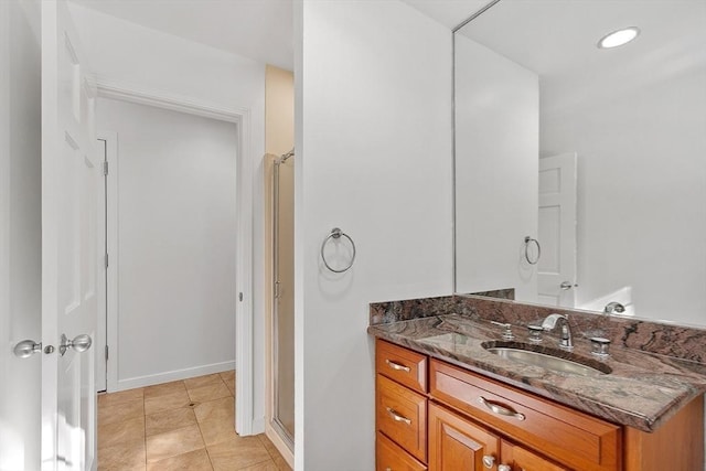 bathroom featuring tile patterned flooring, a shower stall, vanity, and recessed lighting