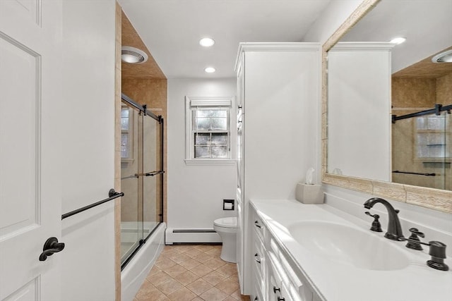 bathroom with toilet, recessed lighting, a baseboard heating unit, vanity, and tile patterned floors