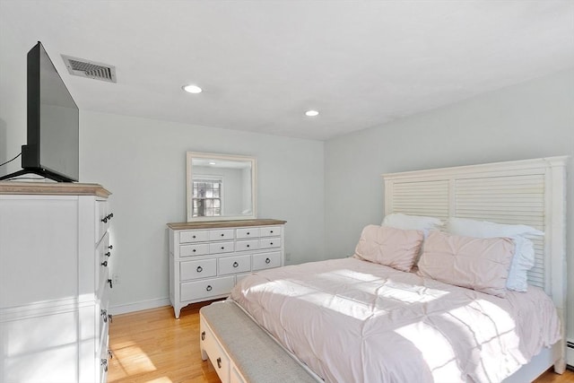 bedroom featuring a baseboard radiator, recessed lighting, visible vents, light wood-type flooring, and baseboards