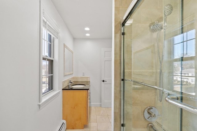 full bathroom featuring a wealth of natural light, tile patterned flooring, tiled shower, and vanity