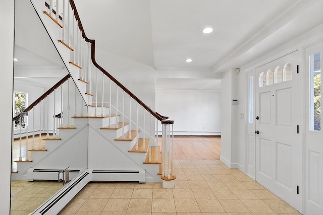 tiled entrance foyer featuring recessed lighting, crown molding, baseboards, and stairs