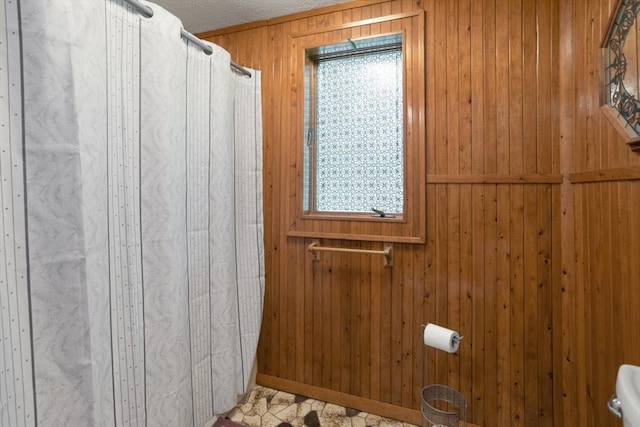 121 Liberty St, Middleton, MA 01949 - bathroom with wood walls, a textured ceiling, and a shower with shower curtain